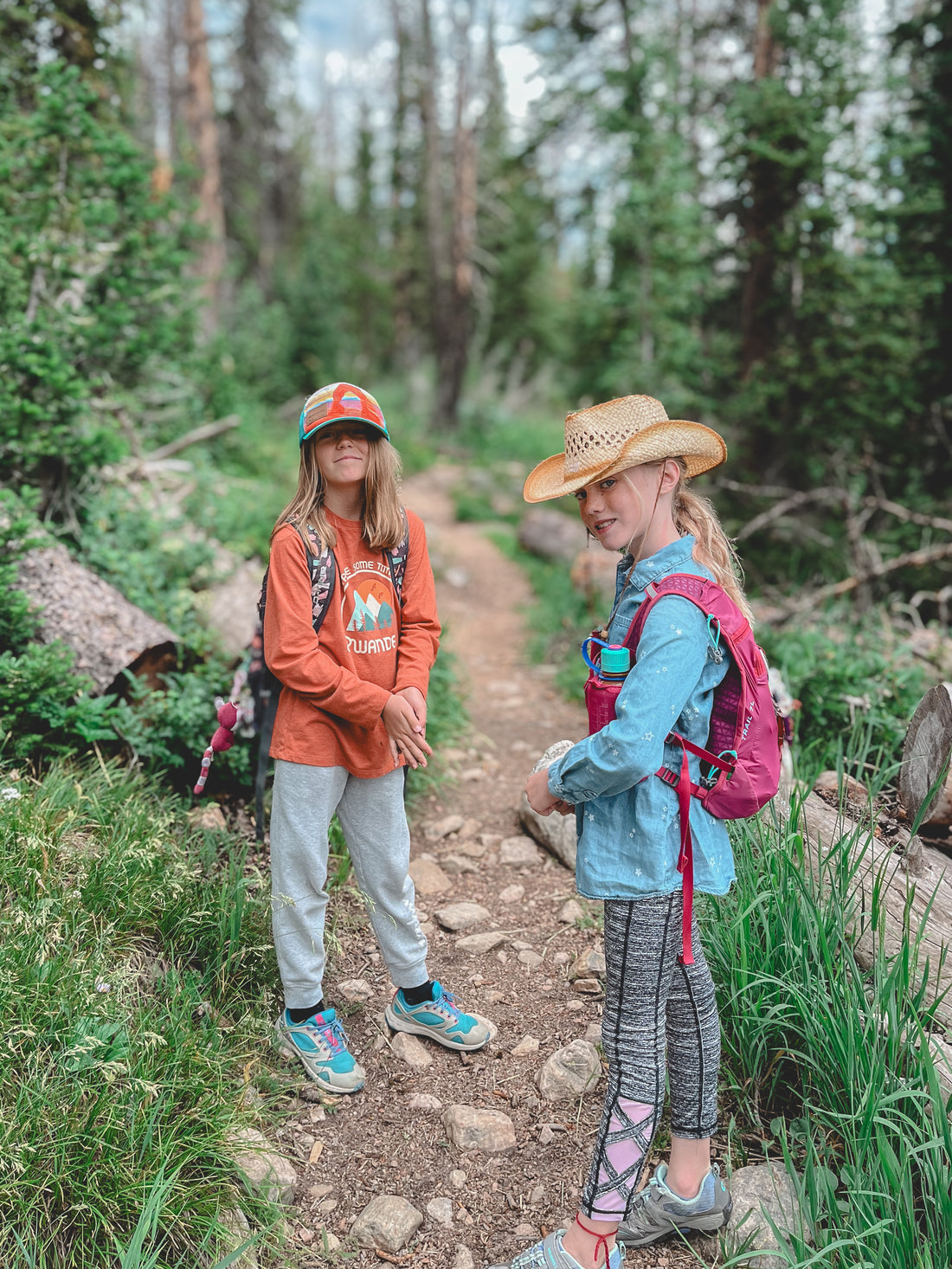 Two Campers stop on a trail in the Uinta Mountains for a photo.